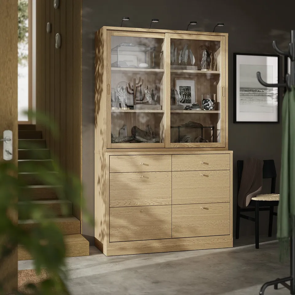 Wooden cabinet & chest with glass doors, oak finish, classic design, larger than chair.