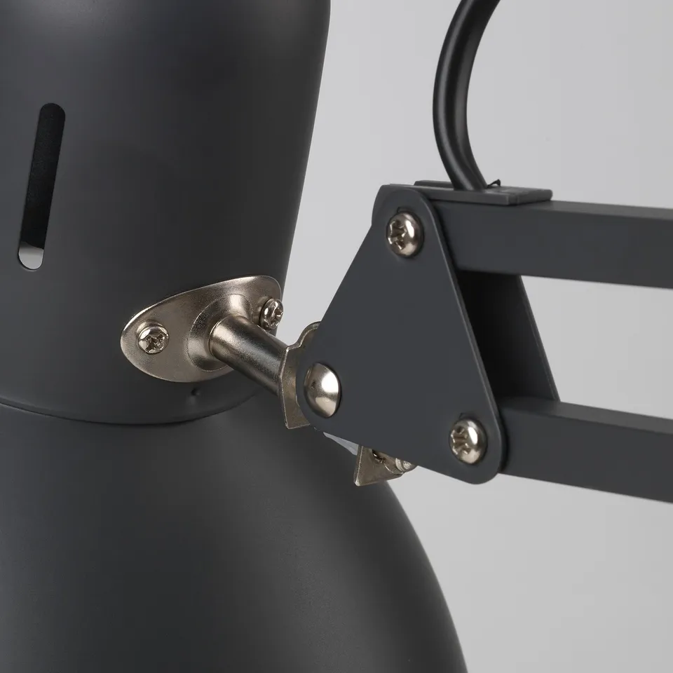 Close-up of TERTIAL lamps adjustable metal arm and clamp, showing sturdy screws and quality construction.
