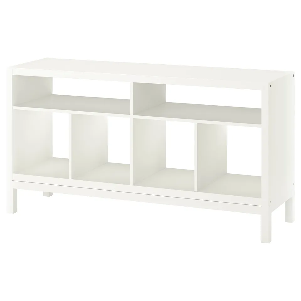 A white KALLAX tv stand with open shelves for storage and cable management. It is rectangular with clean lines and a simple design.