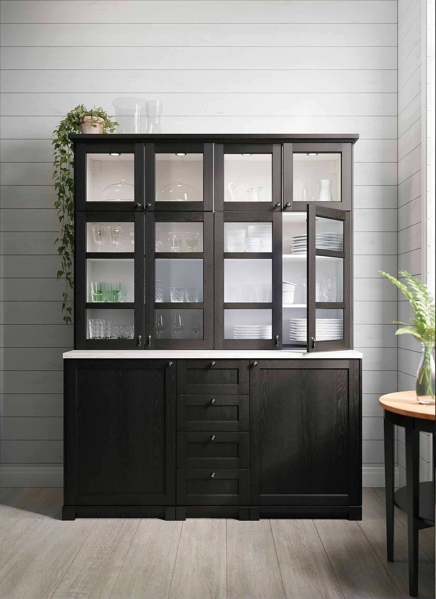 Black wooden cabinet with glass doors, internal led lights showcasing dishware.