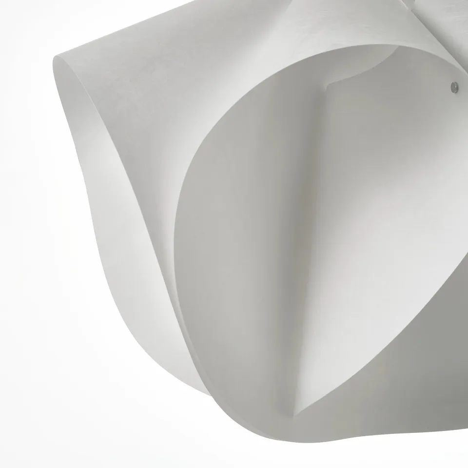 Flower-like, soft white shade; robust, recyclable synthetic material.
