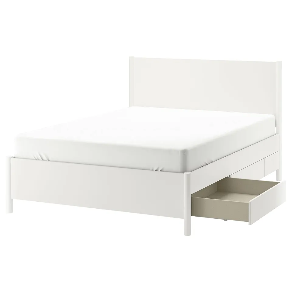 A white TONSTAD bed frame with drawers and a headboard. Its modern, with a clean design and storage drawers.