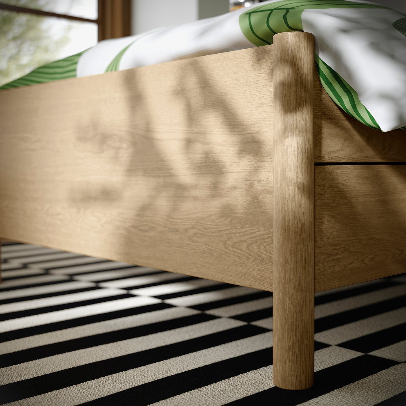 Clean, modern bed frame with light wood finish and soft-close drawers, presented on a stylish striped rug, showcasing high-quality craftsmanship.
