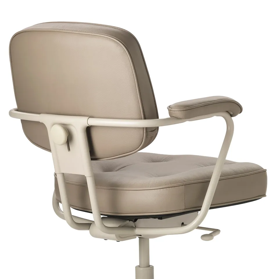Elegant, ergonomic office chair with sleek beige leather, adjustable armrests, and supportive backrest, exuding premium quality and comfort.