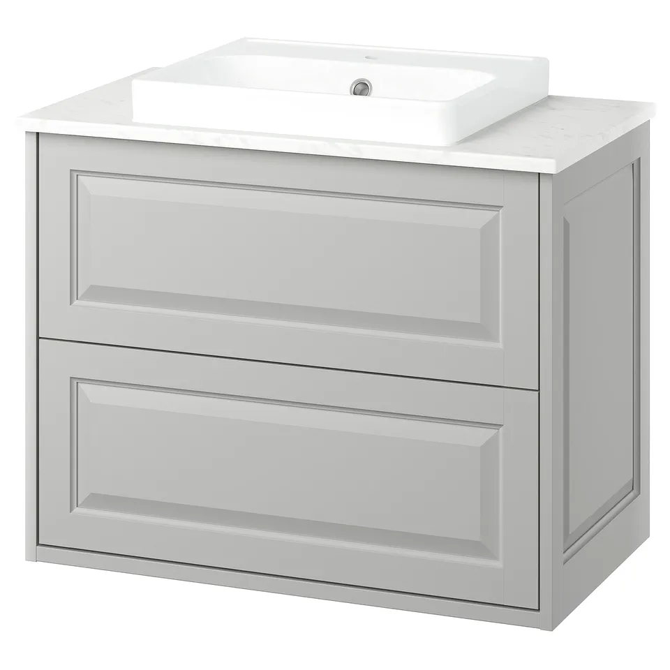 A TÄNNFORSEN light grey bathroom vanity with drawers and a square white marble top with a single, round ceramic basin.