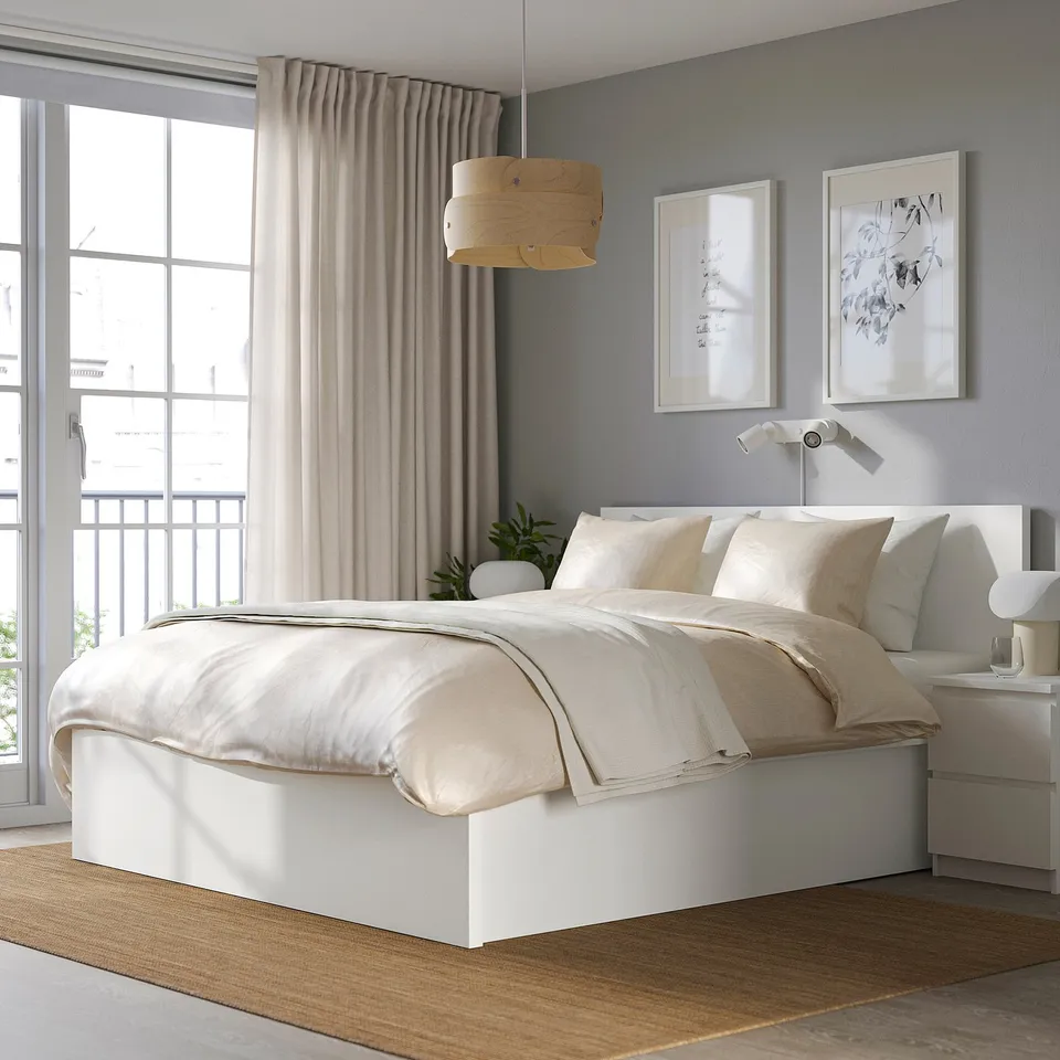 Minimalist bedroom with MALM bed, pendant light, and large window.