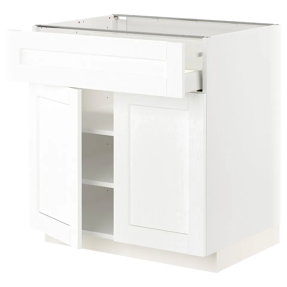 White kitchen cabinet from IKEAs METOD series. It has a glossy finish, square shape, and two adjustable shelves.