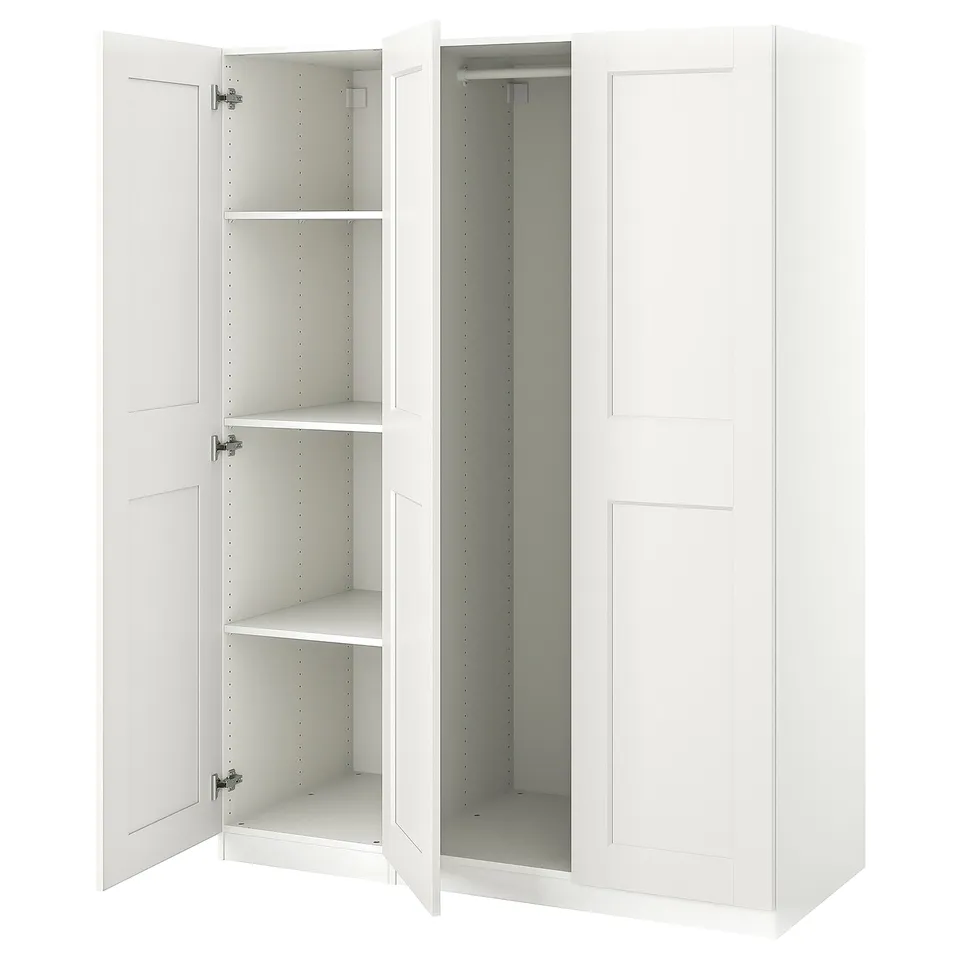 Depicts a white ikea PAX wardrobe with mirrored doors. It stands tall with multiple shelves inside.