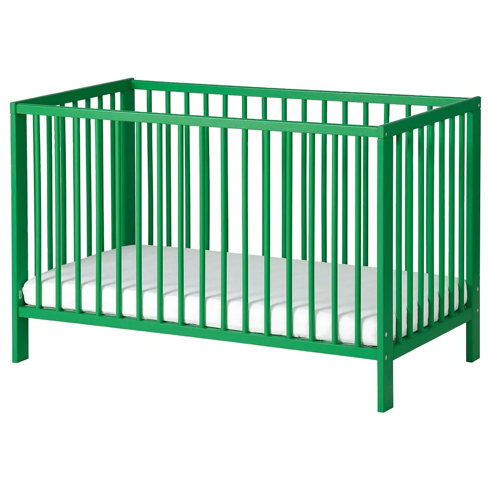 Green GULLIVER baby crib with mattress, rectangular, wooden slats.