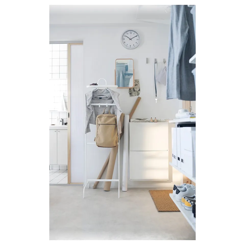 Small white storage unit, wooden top, minimalist design, ideal for entryways.