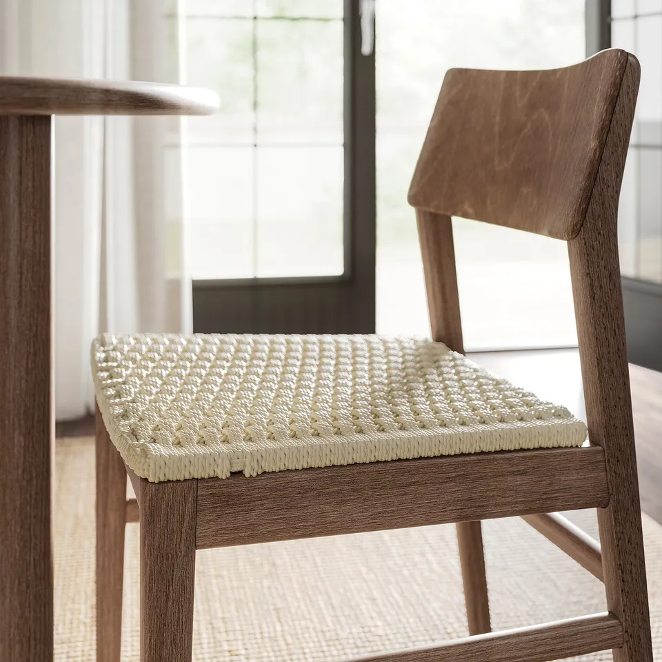Modern wooden chair with woven seat, stylish and comfortable, ideal for dining.
