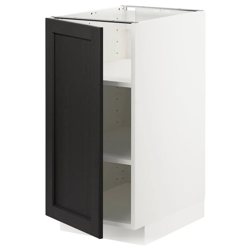 A white METOD kitchen cabinet with a single black stained door featuring bevelled edges. The cabinet stands alone with one shelf.