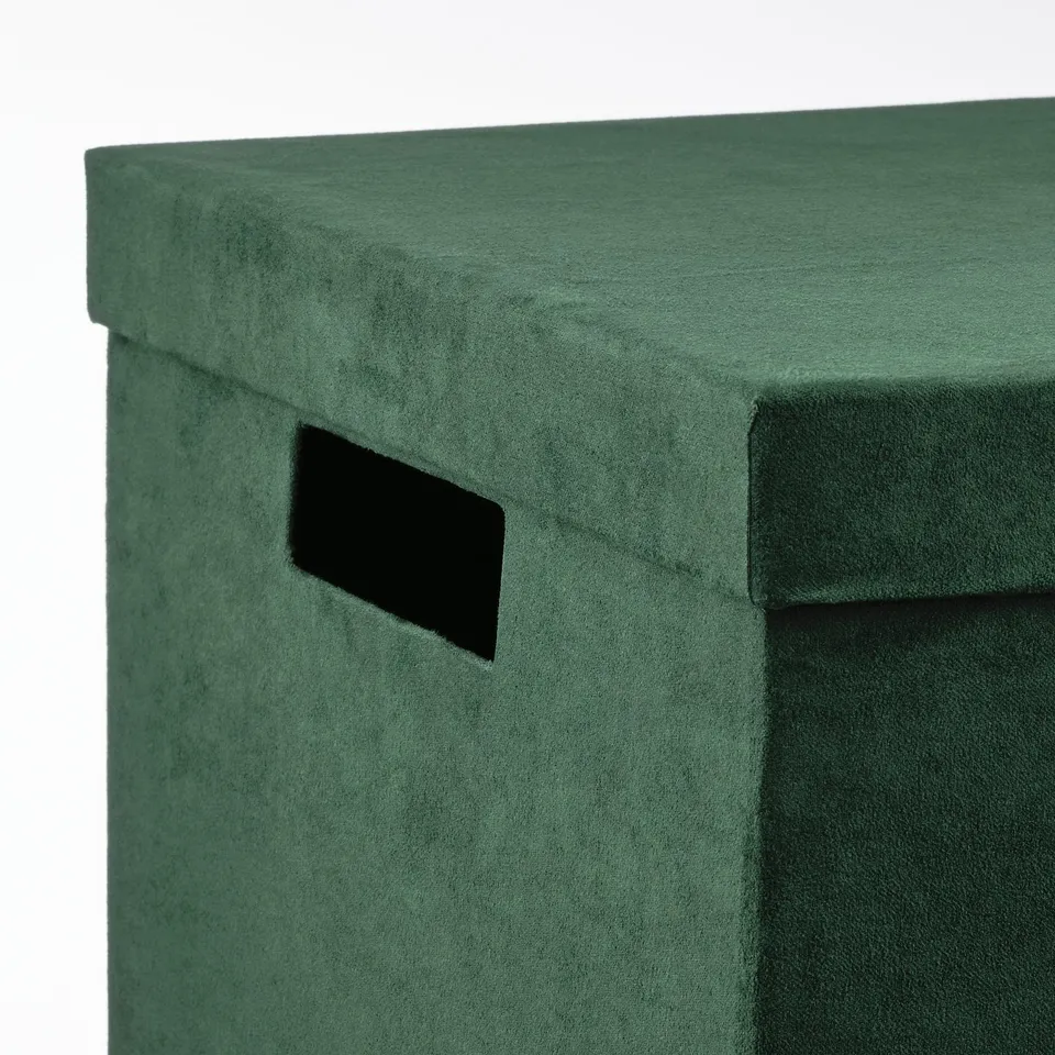 Square green velvet storage box with cut-out handle, showcasing quality design and texture.
