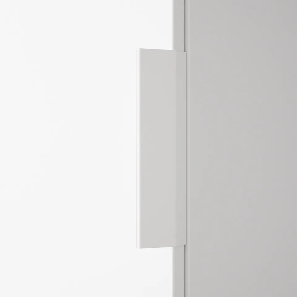 A minimalist white handle mounted on a smooth wall, showcasing modern design and quality material.