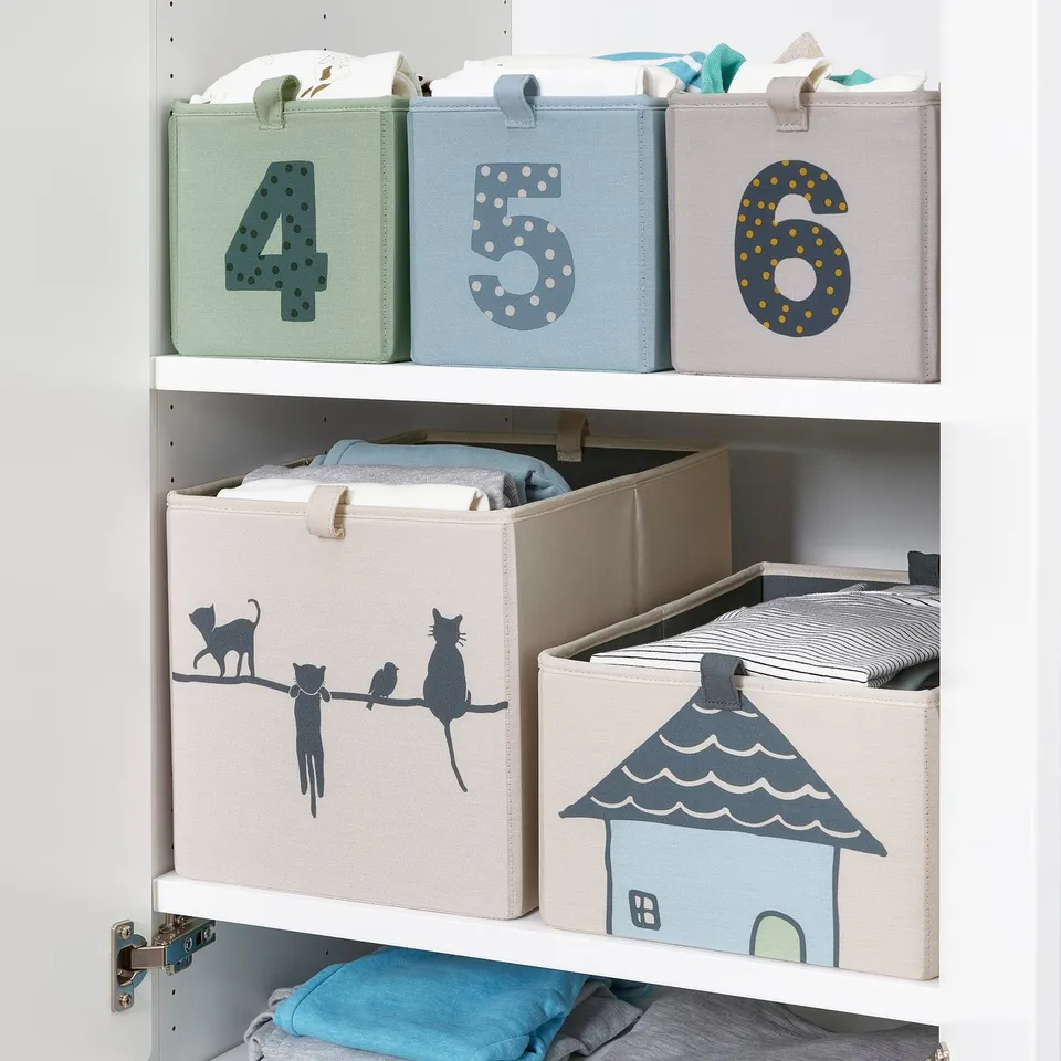 Three fabric storage boxes, numbered 4-6, organised on shelves. Each box has handles and folds flat when not in use.