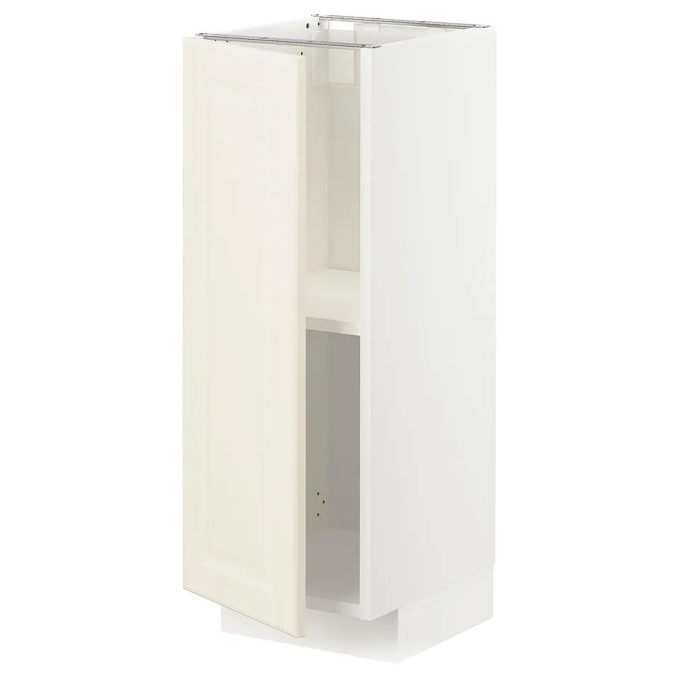 A white METOD kitchen cabinet with a traditional design and bevelled edges. Its rectangular, has a door, and is made of fibreboard and particleboard.