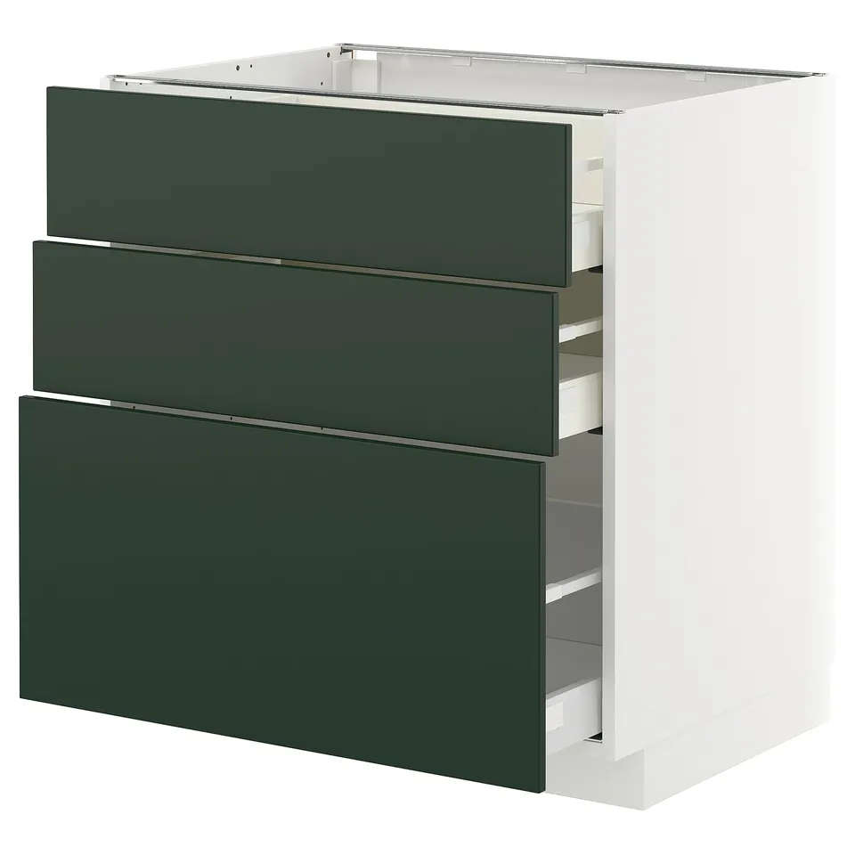 Modern kitchen unit with three dark green drawers, white frame.
