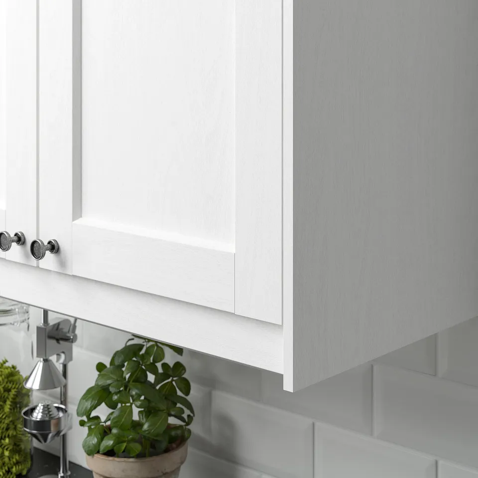 White cabinet with wood grain trim, hiding lights.