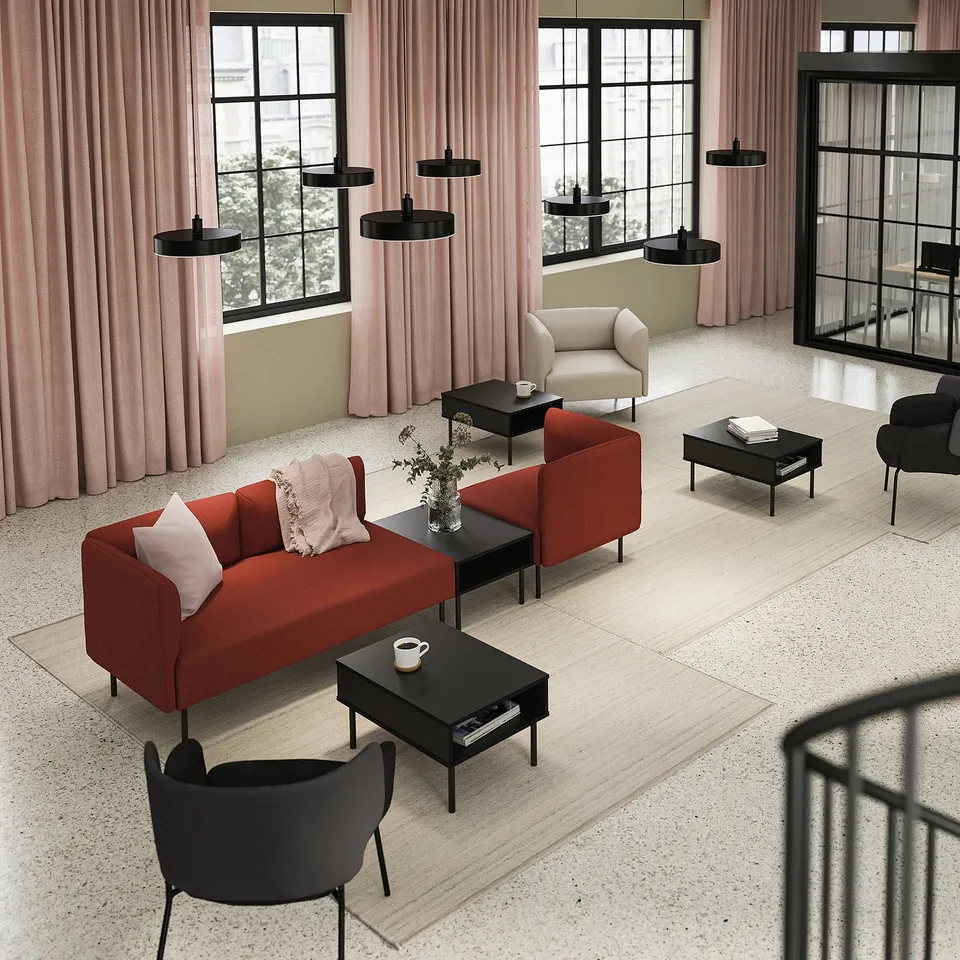 Modern living room with LILLEHEM orange sofa, cream chair, black coffee tables, pink curtains, and black pendant lights.