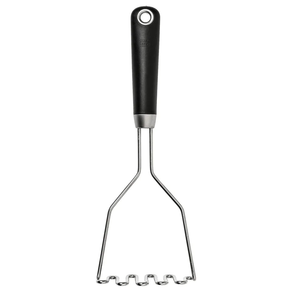 Black kitchen masher with silver metal wires, rubber-coated grip, and hanging hole from IKEA 365+.