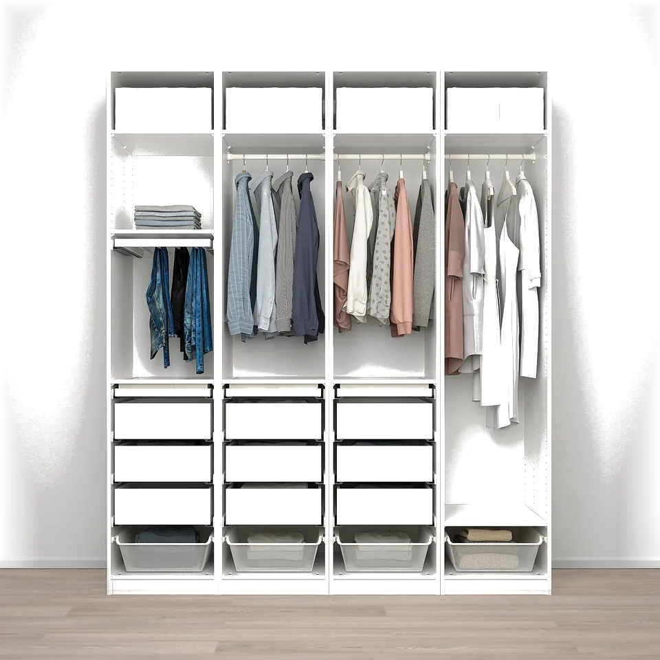 A wardrobe with white drawers and hanging space for clothes. Shelves hold folded clothes and bins at the bottom.