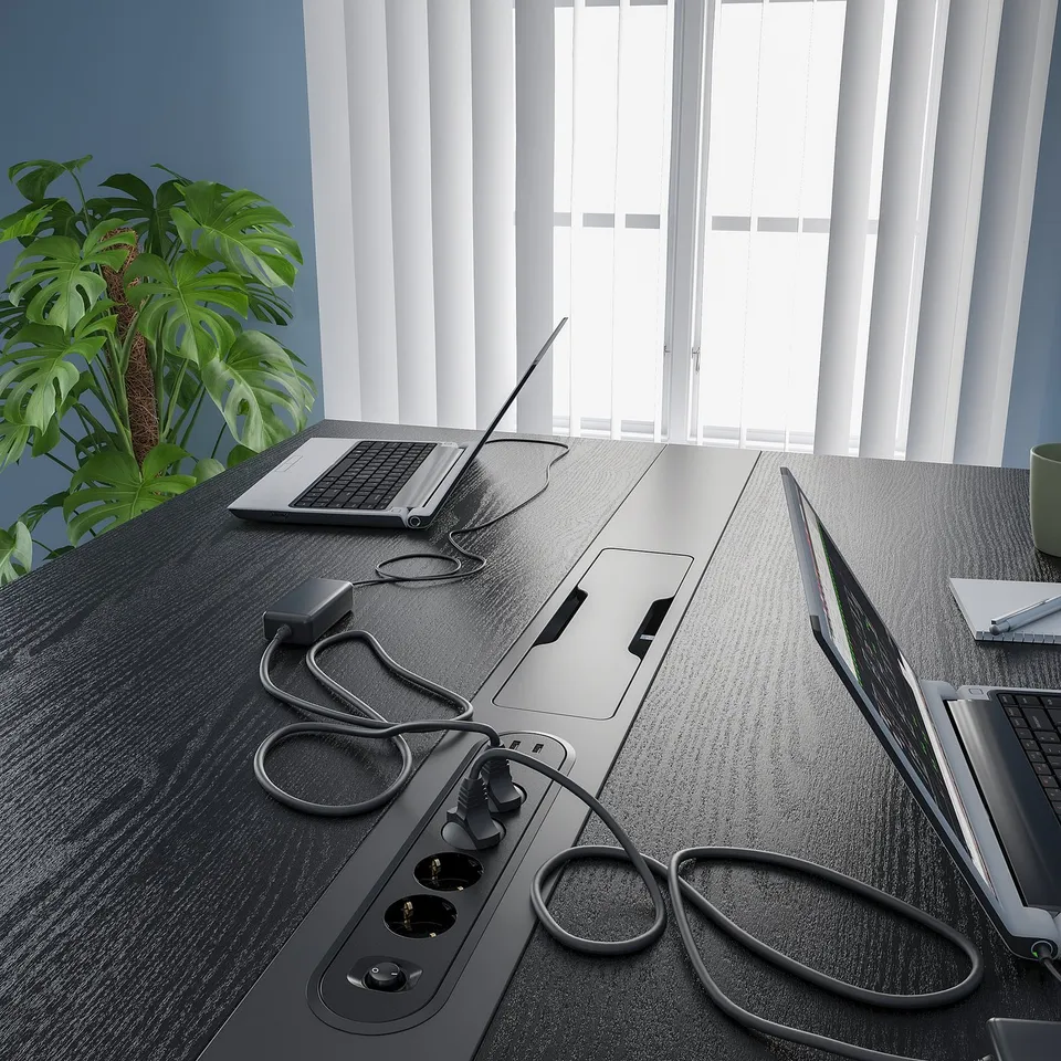 High conference table with cable management and footrest support, ideal for meetings.