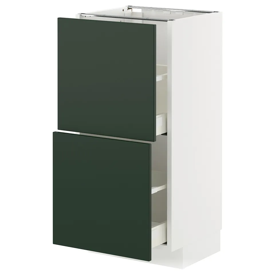 A white vertical bathroom cabinet with two green drawers.