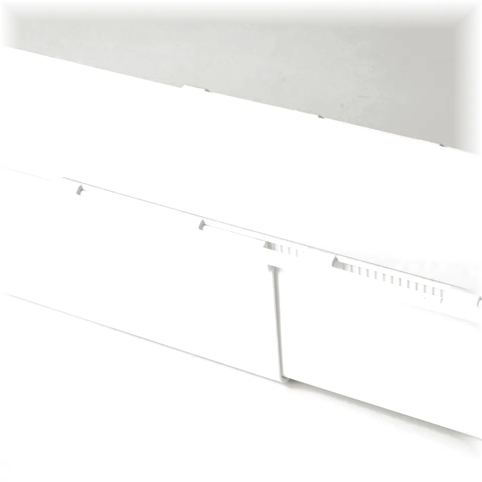 White extendable storage box, part of a modern organisation system. Shows part of a white box with grooves, indicating adjustability.