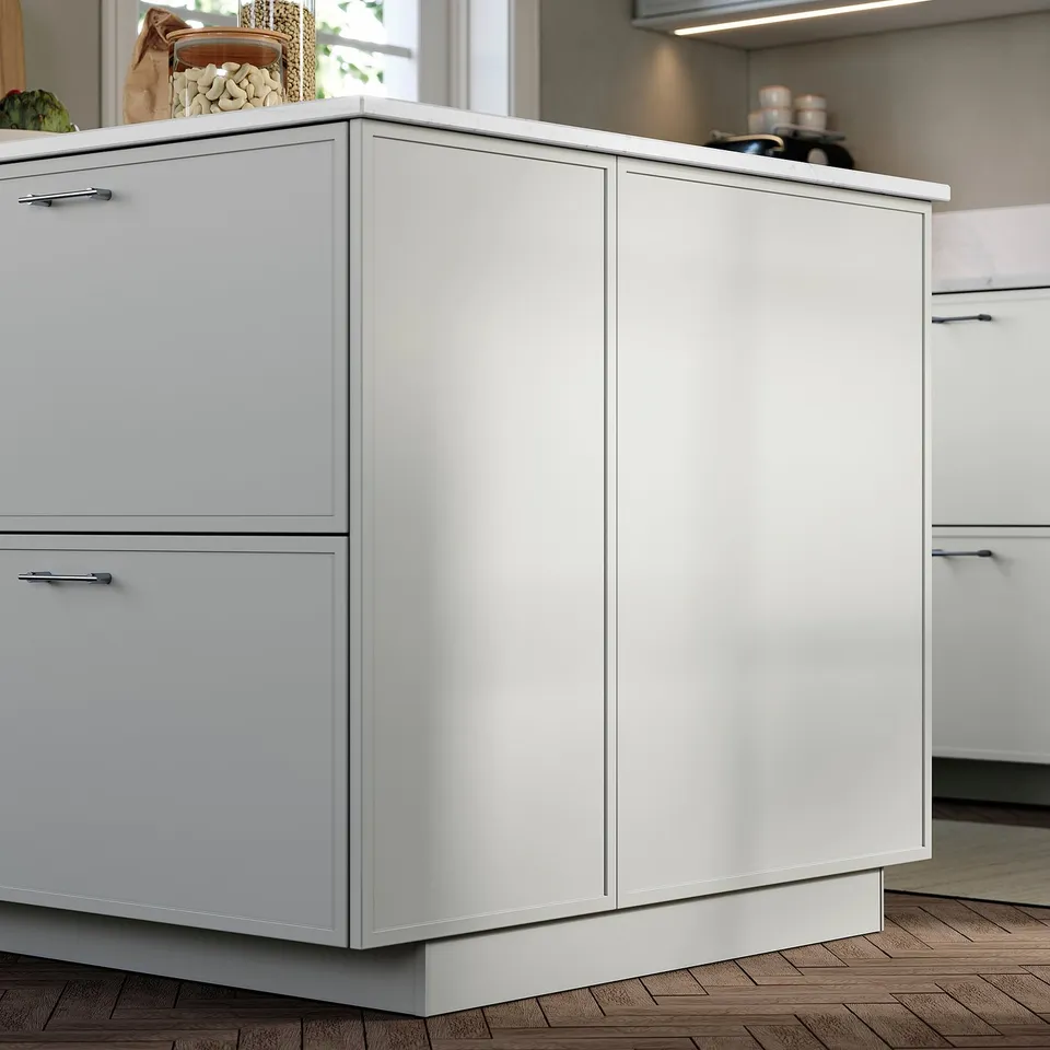 Modern kitchen with white ASPUDDEN panels; sleek, minimal design.