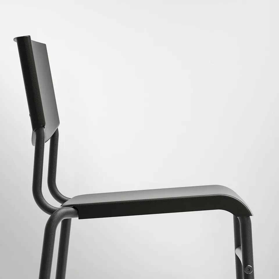 Modern, sleek bar stool with backrest, curved seat, and sturdy metal frame. Designed for comfort and easy cleaning.