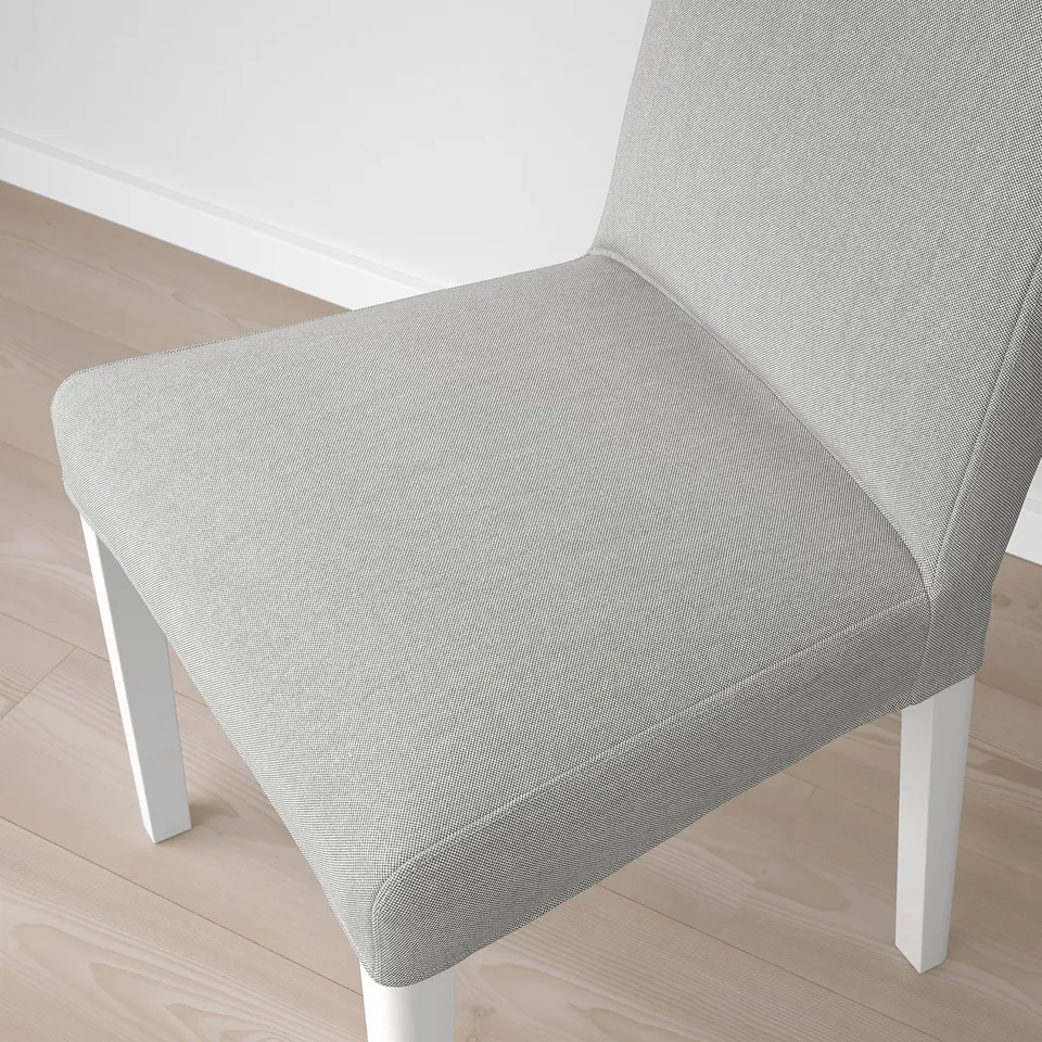 Chair with smooth fabric and sturdy legs, well-crafted for comfort.