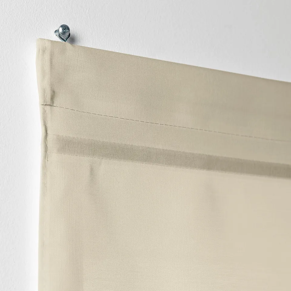 Beige RINGBLOMMA roman blind, adjustable magnets, mounted with metal anchor.