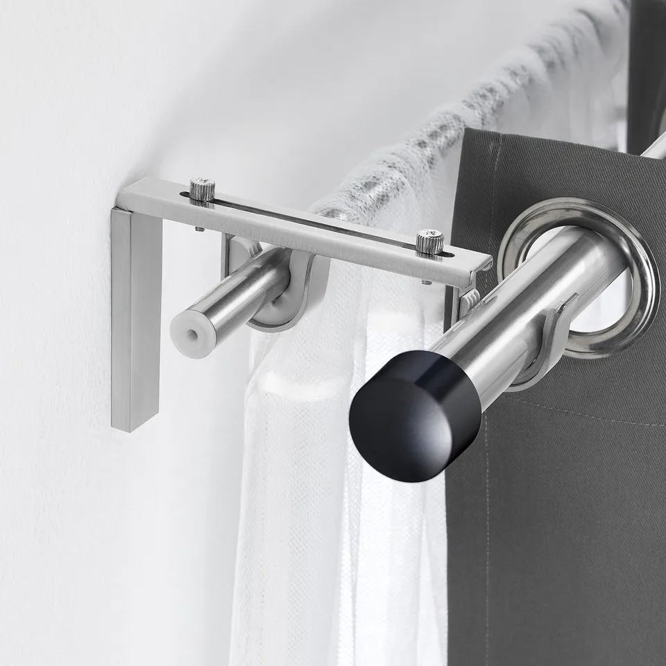 Small BETYDLIG nickel rod holder. Holds double curtain rods securely. Screws into wall bracket, fits räcka and hugad.