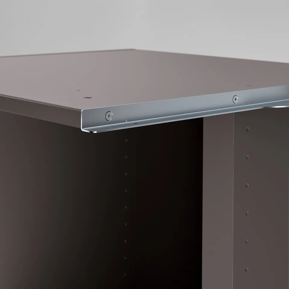 Modern storage unit with sleek, silver edging and dark finish, designed for efficient use of corner space.
