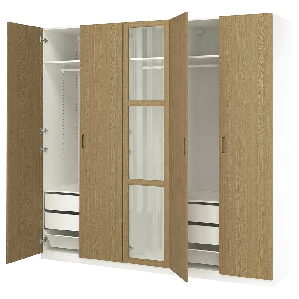 Wooden PAX wardrobe with glass doors, featuring multiple shelves and drawers, in light brown finish.