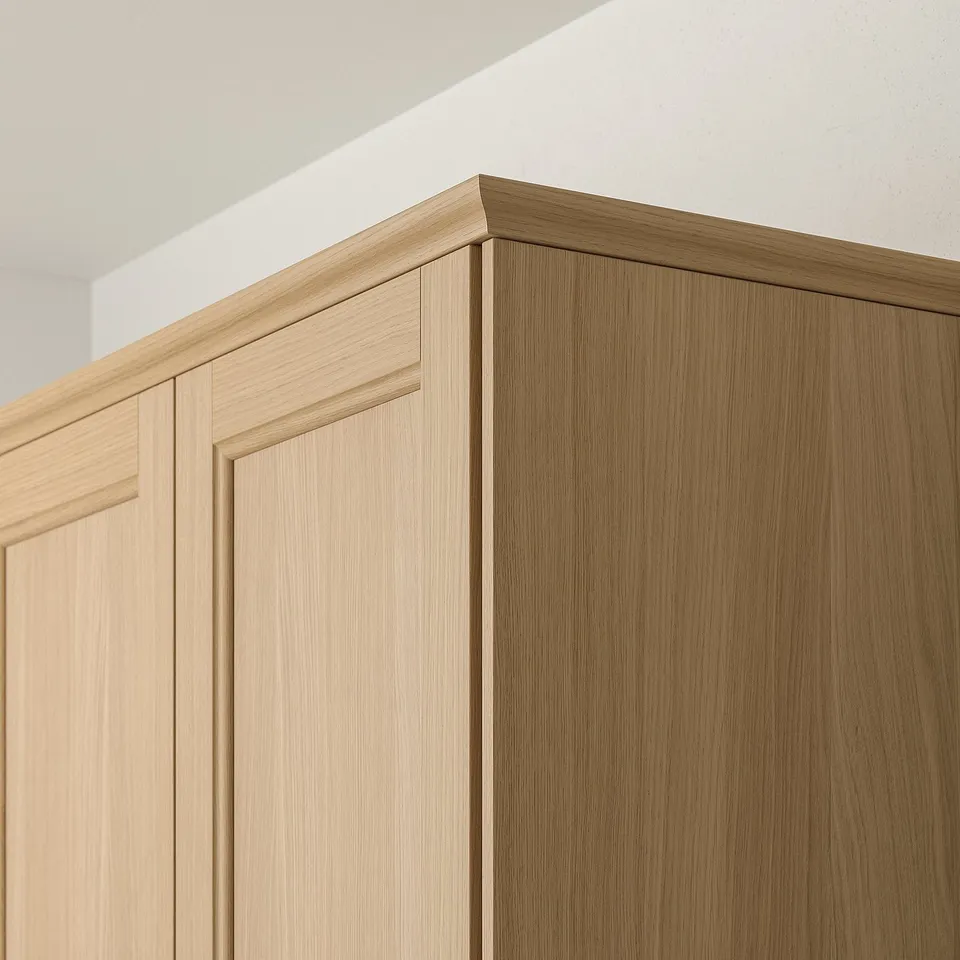 Wooden kitchen cabinet trim in oak finish, showcasing robust design suitable for hiding lighting and cords.