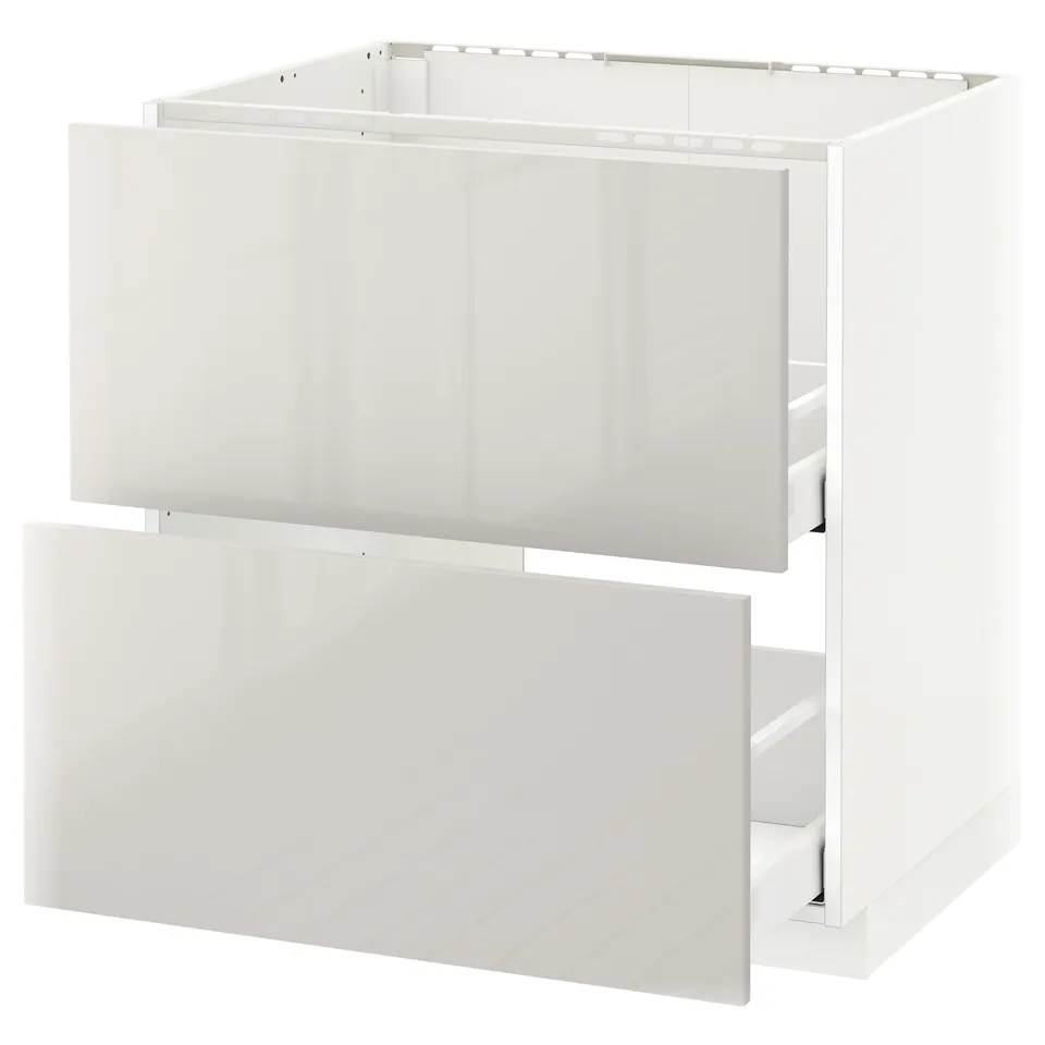 Modern white kitchen cabinet with open drawers, glossy finish.