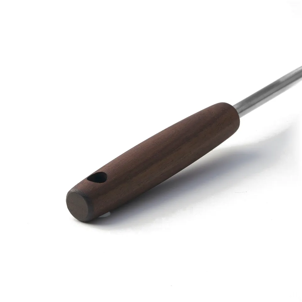 Elegant kitchen tool with dark walnut handle and stainless steel rod, designed for a firm grip and easy storage.