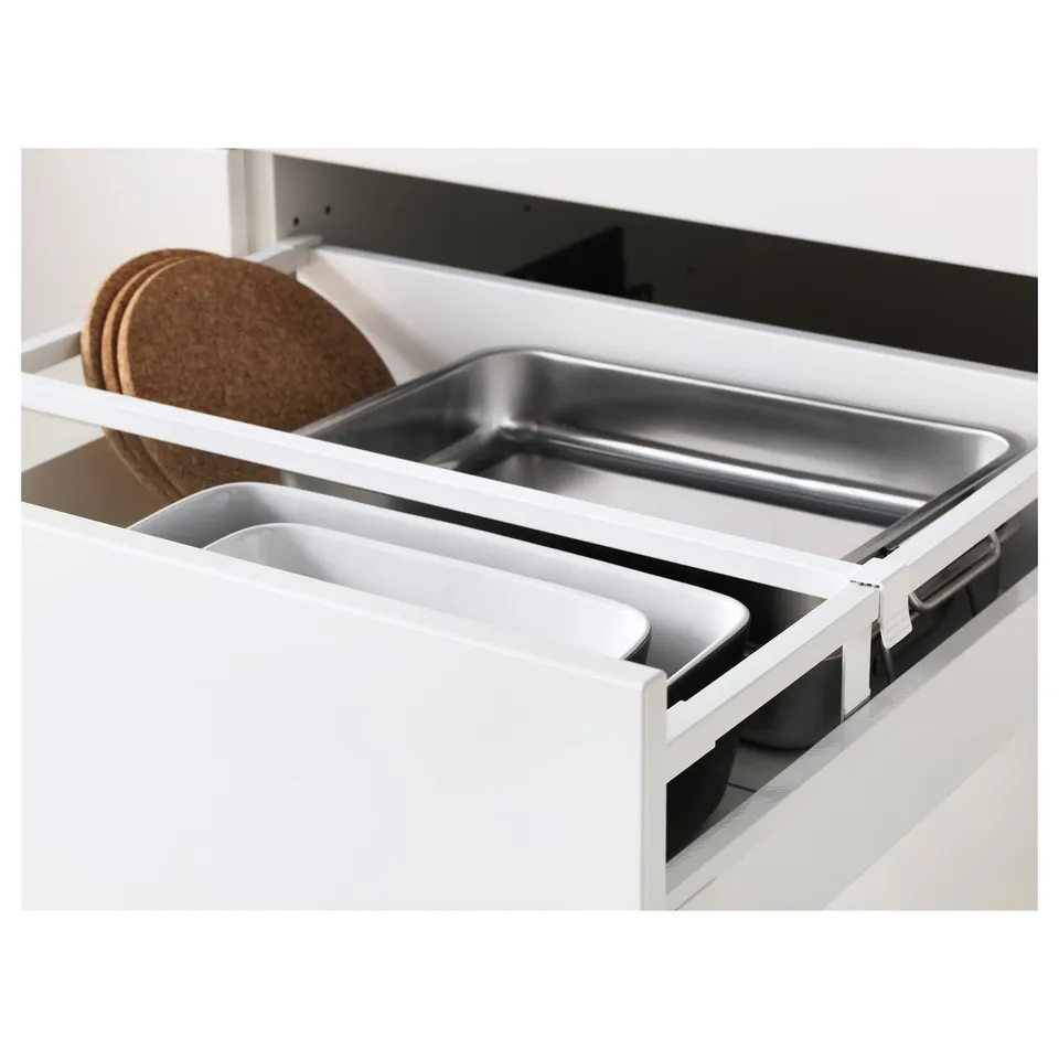 White kitchen drawer organiser with metal tray and cork coasters, smooth-running and adjustable.
