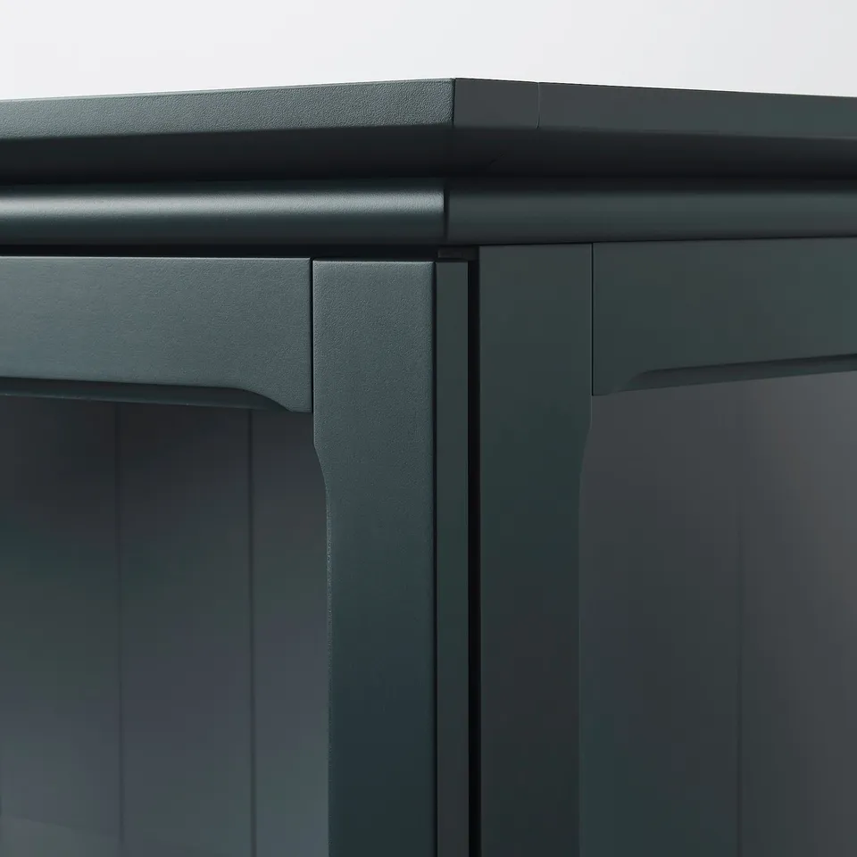 Close-up of sleek, black cabinet with smooth, soft-closing doors and sturdy build.