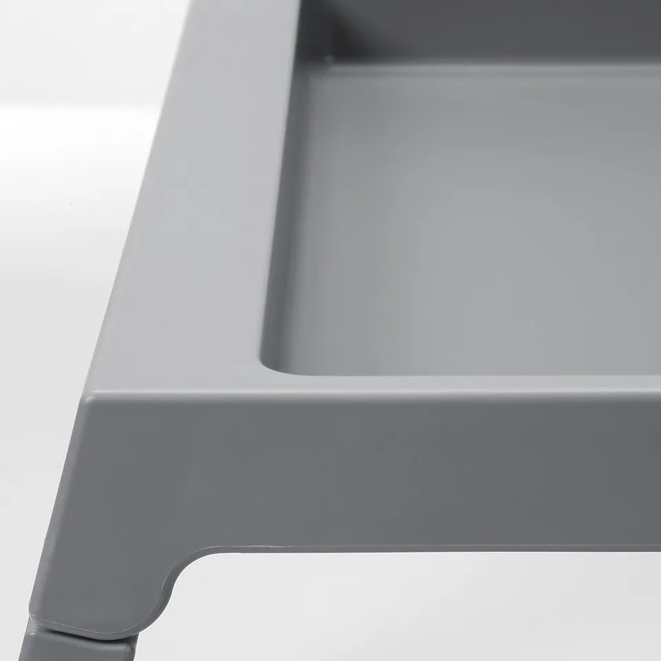 Close-up of grey KLIPSK bed trays smooth edge & sturdy design.