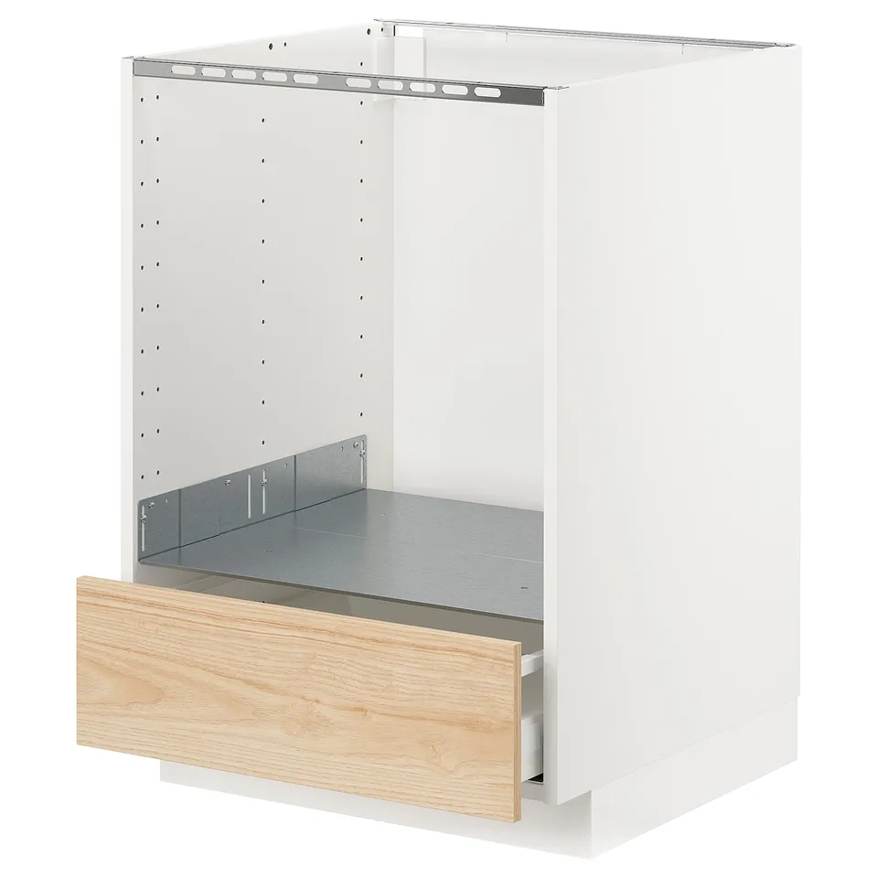A white ikea METOD kitchen cabinet with a light ash drawer, partially open, revealing wooden front and metal interior.