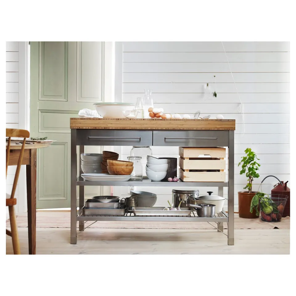 RIMFORSA kitchen island in natural bamboo and stainless steel. Drawers, shelves, and hooks for storage and workspace.