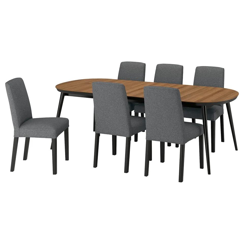 Modern 6-seat dining set with dark grey fabric chairs, oval walnut table, sturdy legs.
