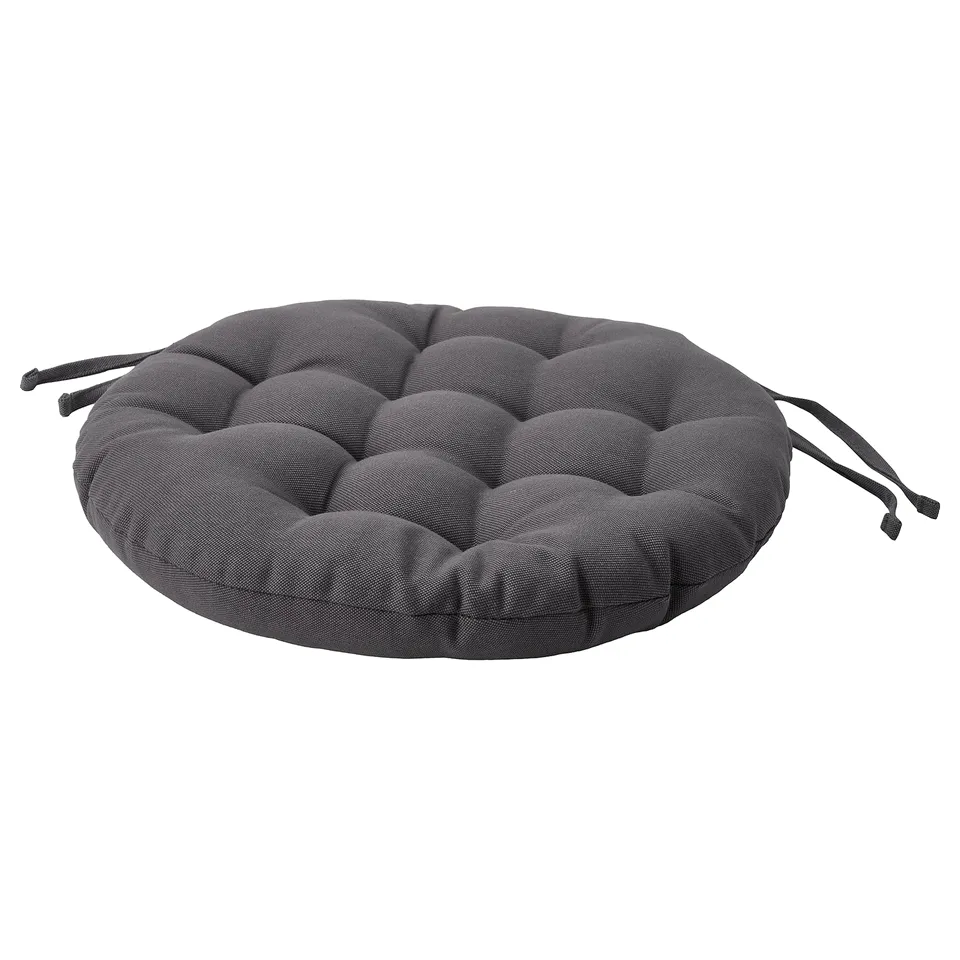 This is a round, dark grey VIPPÄRT seat cushion with decorative ties, made from recycled materials.