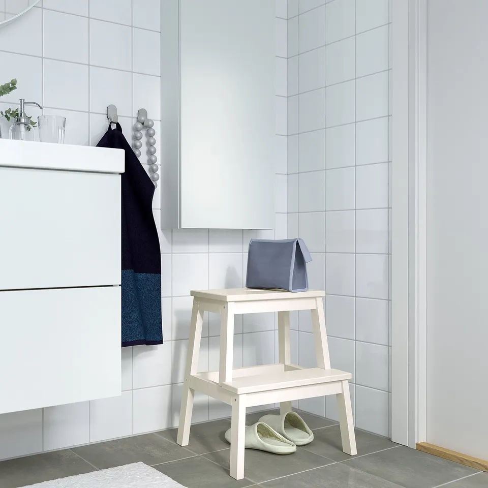 Bathroom: BEKVÄM step stool with towel and slippers.