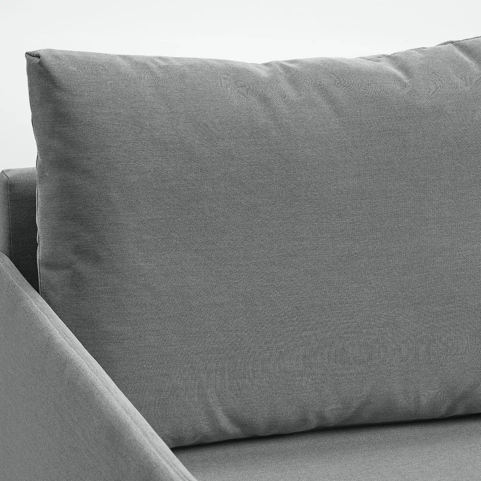 Grey FRIDHULT sofa bed corner, showcasing neat design and supportive cushions, ideal for small spaces.