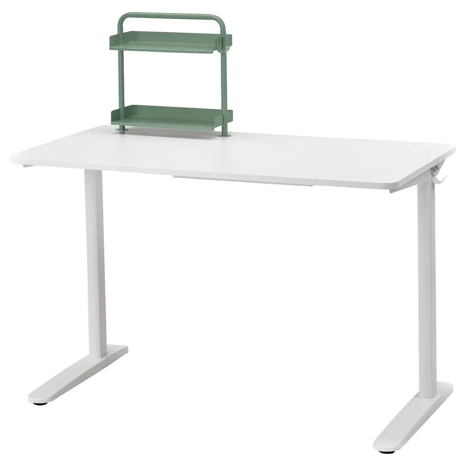 A white RELATERA desk with a green shelf organiser. The modern design includes hooks for backpacks and headphones.