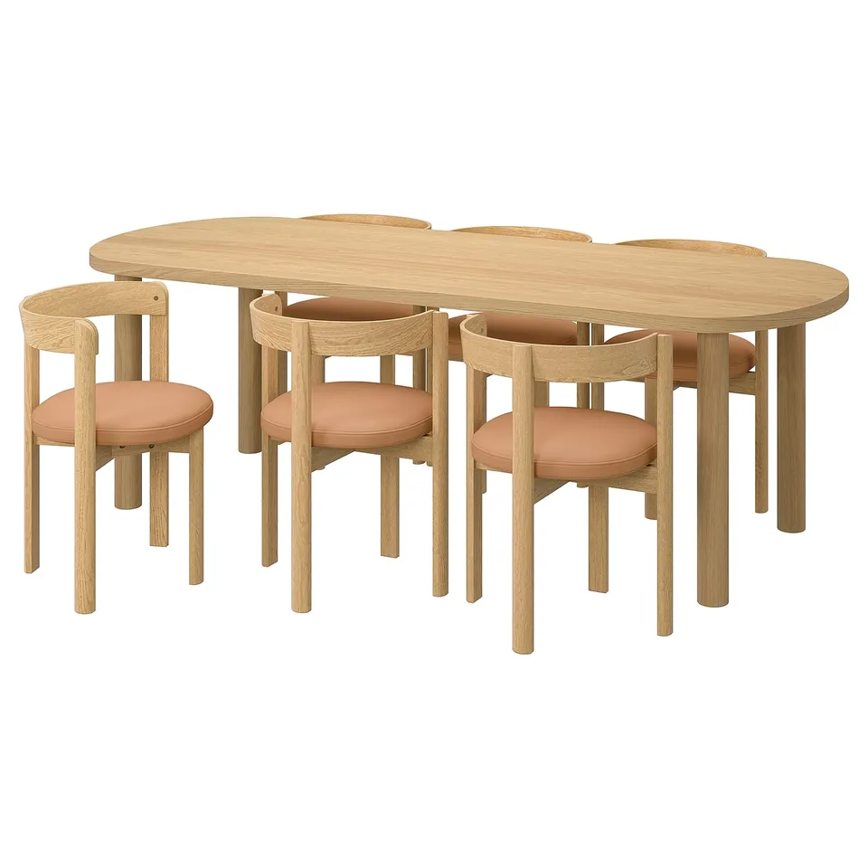 Oval light oak dining set with six peach leather chairs, modern scandinavian design.