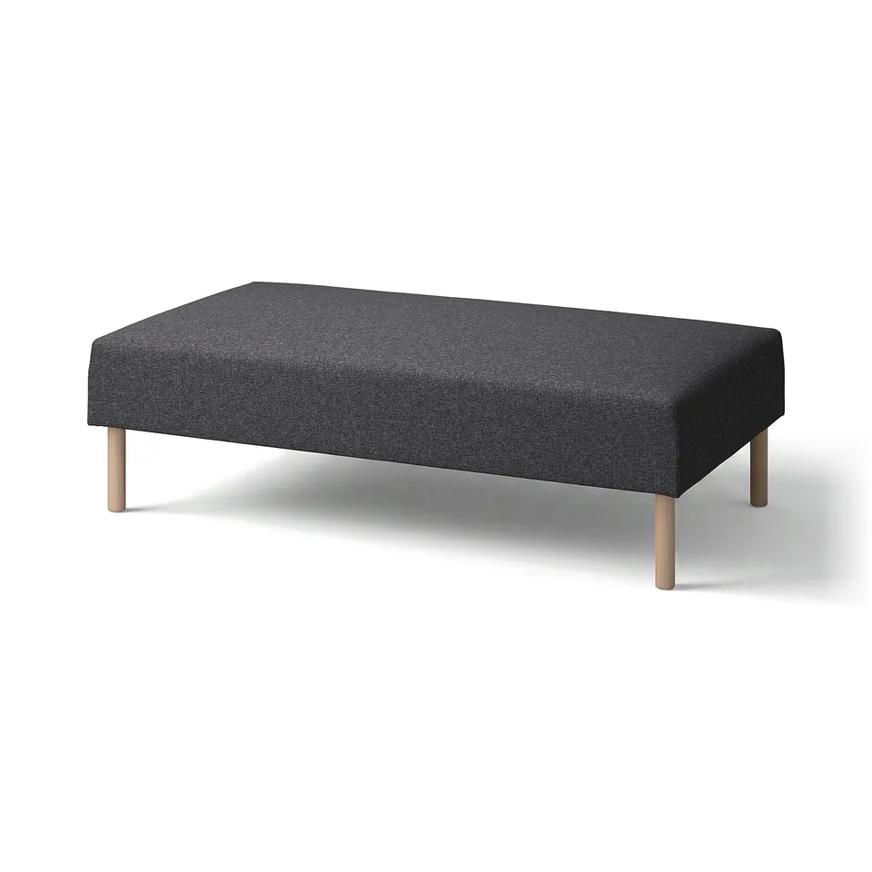 A modern, dark grey LILLEHEM ottoman with a sleek rectangular shape and wooden legs, offering a minimalist design.